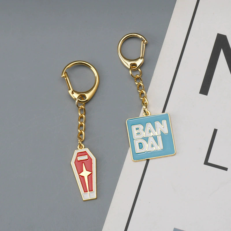 Bandai Logo & Gundam Shield Gold Keychain – Premium Mecha Collectible Accessory