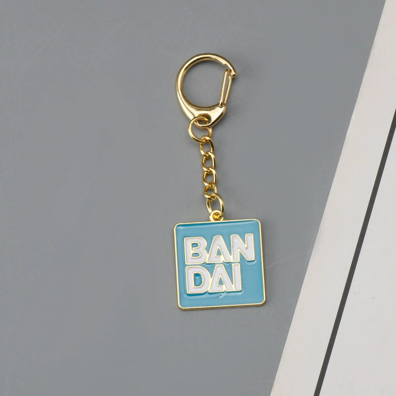 Bandai Logo & Gundam Shield Gold Keychain – Premium Mecha Collectible Accessory
