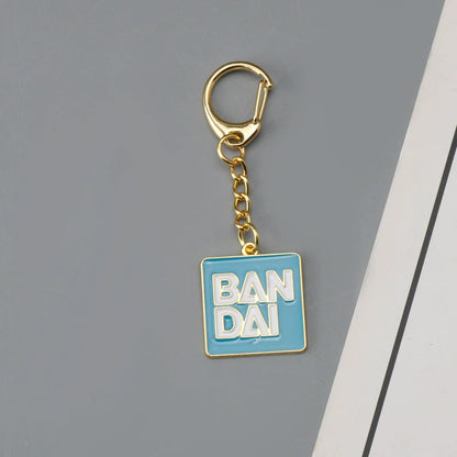 Bandai Logo & Gundam Shield Gold Keychain – Premium Mecha Collectible Accessory