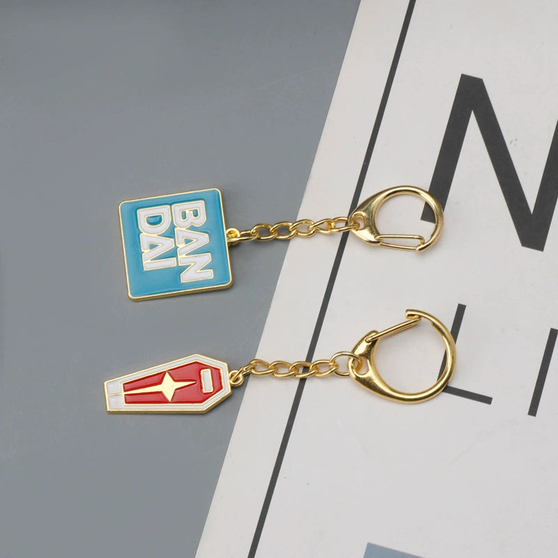 Bandai Logo & Gundam Shield Gold Keychain – Premium Mecha Collectible Accessory